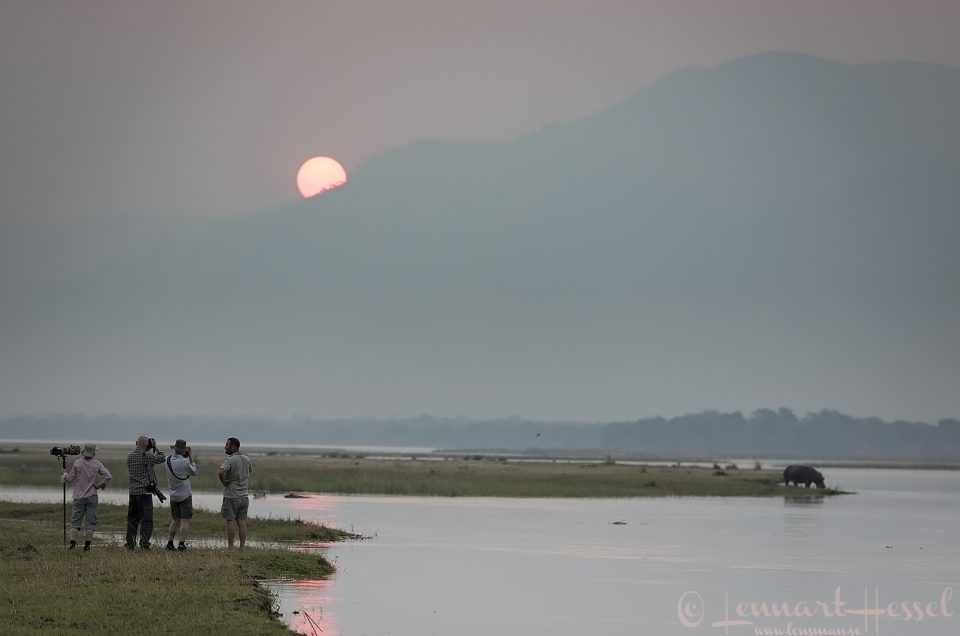 The group at work at sunset mobile safari Mana Pools Zimbabwe